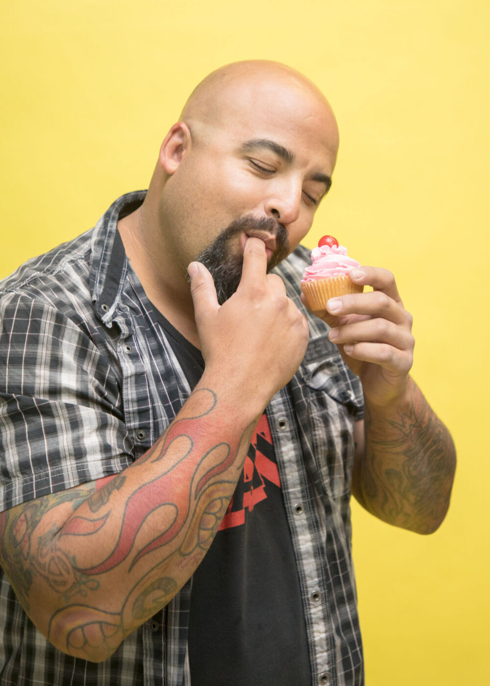 man eats cupcake