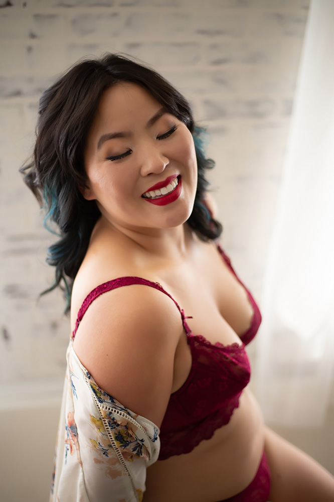 gorgeous lady smiles in red lingerie