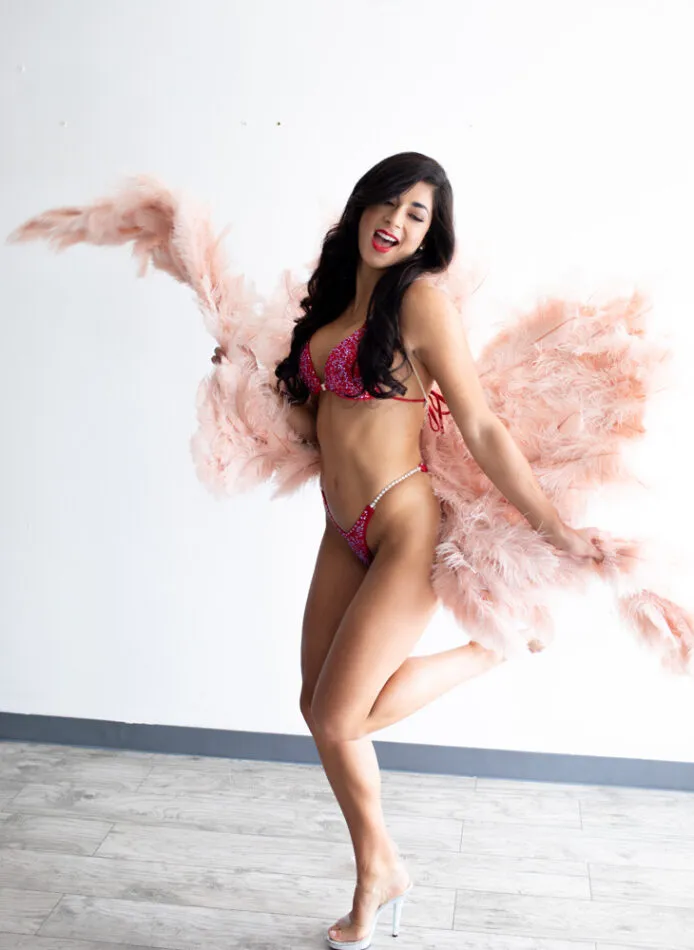Brunette dances in angel wings